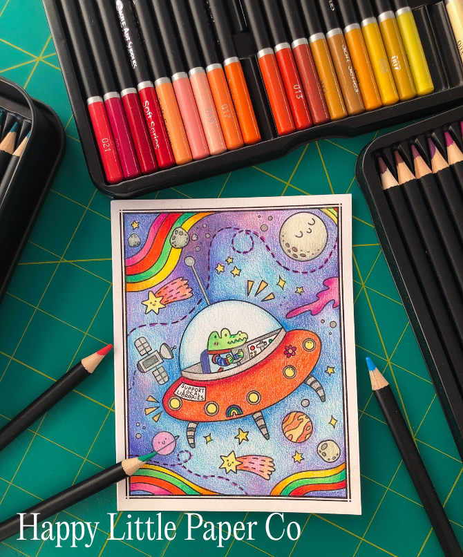 Colored pencils next to an intricately drawn spaceship