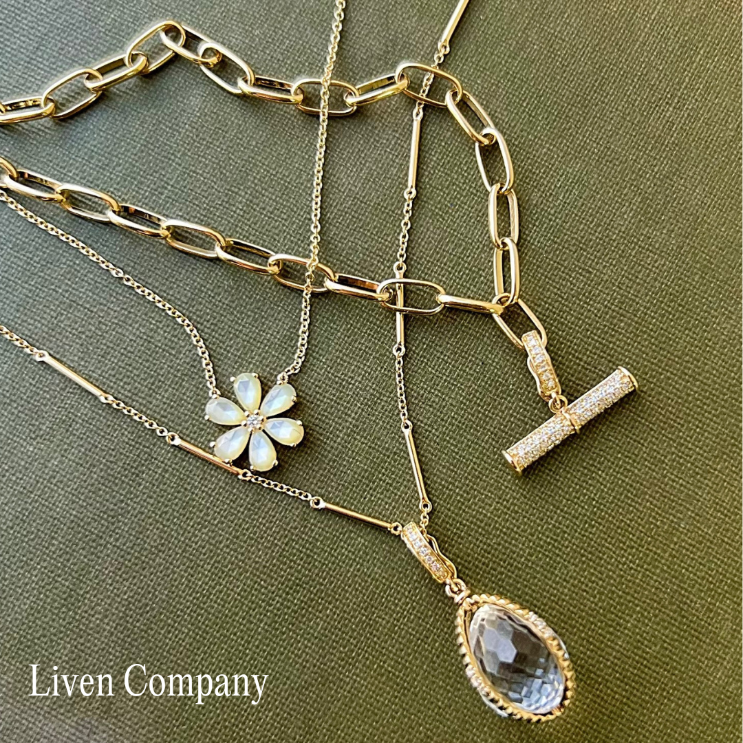 Gold jewelry on a green background