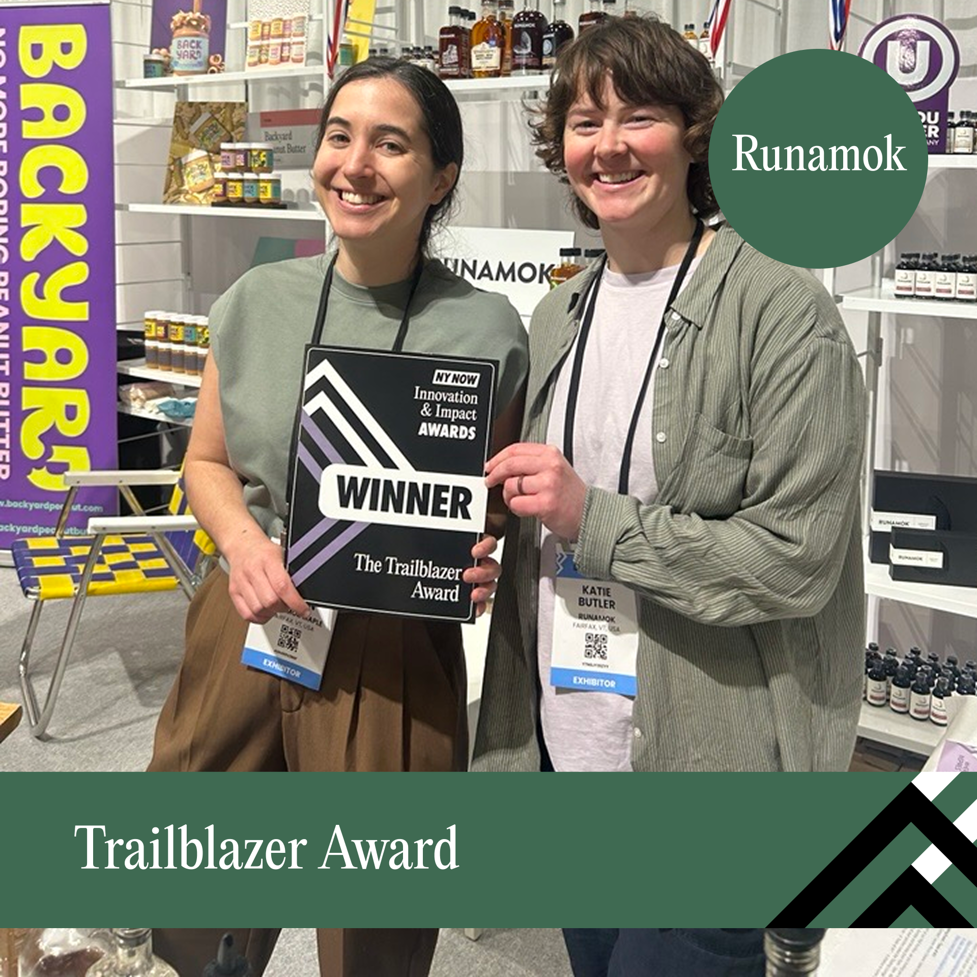 Runamok Two women pose while getting an award
