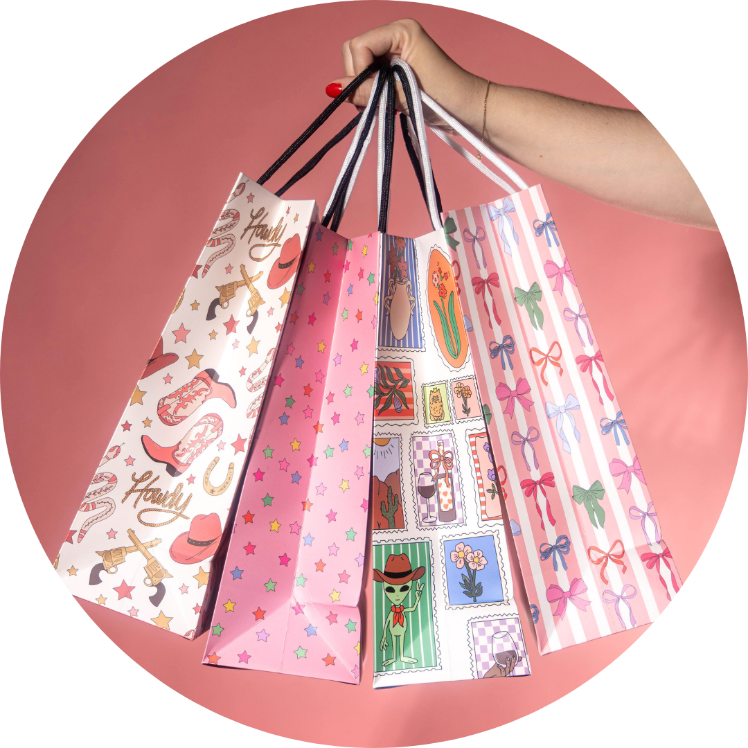 Illustrating Amy A hand holds shopping bags